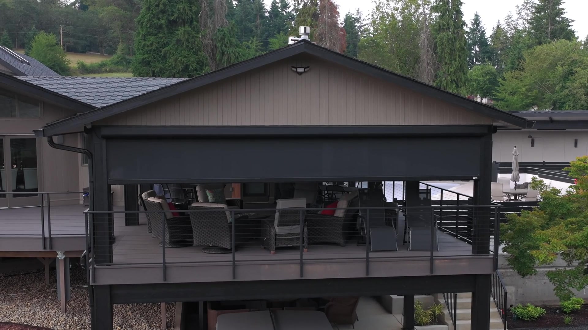 Angled view of Fenetex motorized screens on an Oregon covered deck
