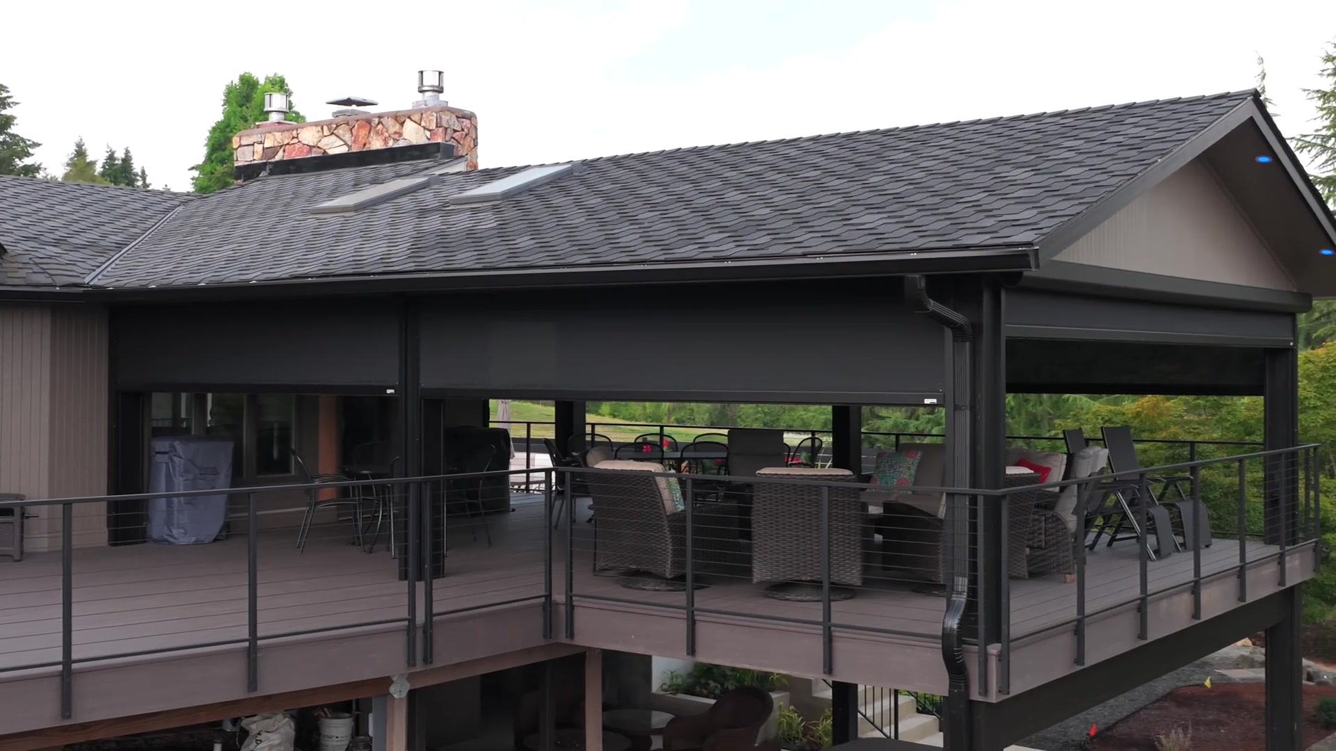 Motorized deck screen partially retracted on Oregon patio